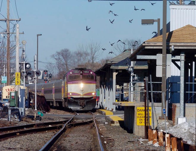 A southbound MBTA commuter train enters the Stoughton Commuter Rail Station.