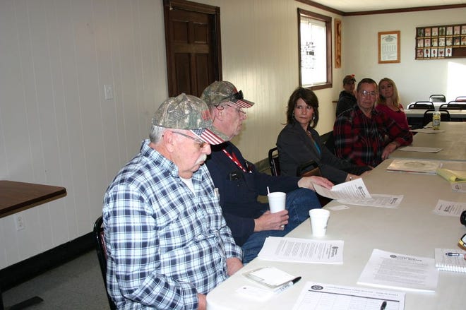 Congresswoman Cheri Bustos (D-East Moline) (middle) speaks with veterans at the Lewistown VFW Monday afternoon about their concerns and the acts she has been pushing for, including the All-American Flag Act which requires that the federal government only purchase American flags produced in the U.S.