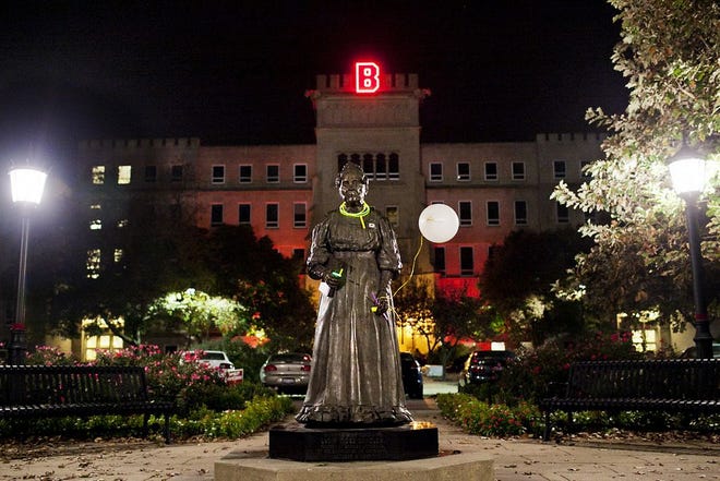 The statue of Lydia Moss Bradley was decorated in homecoming festivities decorations after the lighting of the B party on Wednesday, Oct. 12, 2011.