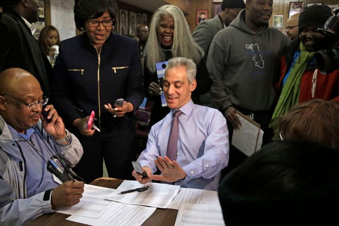 Chicago Mayor Rahm Emanuel joins phone bank workers on election day Tuesday, Feb. 24, 2015, in Chicago. Emanuel hopes to avoid a runoff election, as voters head to the polls and decide whether to give the former White House chief of staff a second term in office. (AP Photo/M. Spencer Green)