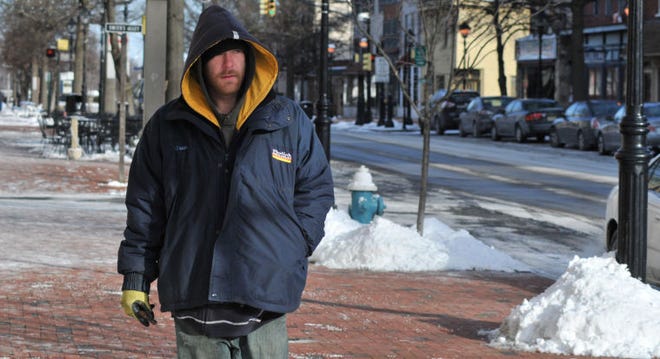 George Taylor, of Willingboro, confronts the bitter cold in the early morning along High Street in Burlington City on Monday, Feb. 16, 2015.