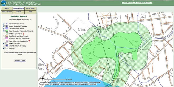 A permit from the Department of Environmental Conservation will be required to commence any development within the green checked area around the protected wetland.