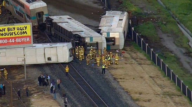 This image from video provided by KABC-TV Los Angeles shows wreckage of a Metrolink commuter train after it crashed into a truck and derailed early on Tuesday, Feb. 24, 2015 in Oxnard, Calif. Three cars of a Southern California Metrolink commuter train have derailed and tumbled onto their sides after a collision with a truck on tracks in Ventura County, northwest of Los Angeles. (AP Photo/KABC-TV)