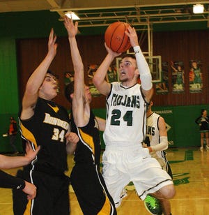 Dwight’s Caleb Boma takes a shot in the paint against Donovan.