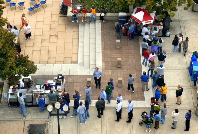 Long lines form at the food carts at the Peoria County Courthouse Plaza in Downtown Peoria.