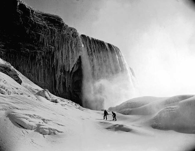 FILE - This Feb. 3, 1951 file photo shows a wall of ice on part of Niagara Falls in New York. Although it appears frozen, the water never actually stops flowing underneath. (AP Photo)