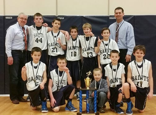 St. Mary’s 6th, shown here after winning the Kevin Casson Memorial tourney, completed a Livingston County sweep with its championship at the Pontiac Junior High tourney.