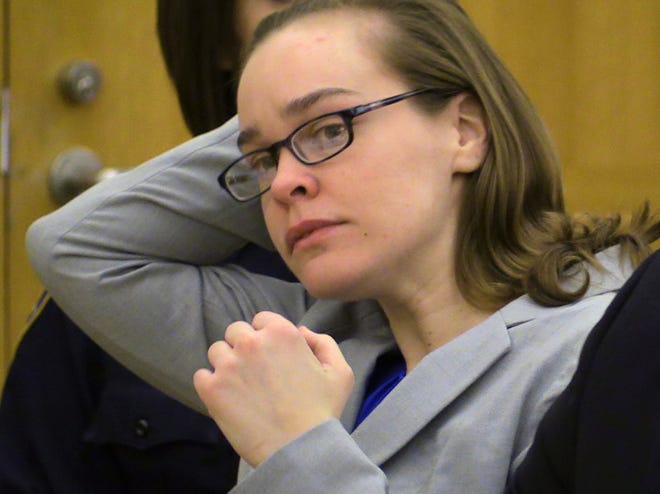 FILE - Defendant Lacey Spears brushes her hair back during the opening statements portion of her murder trial at the Westchester County Courthouse in White Plains, N.Y., in this Feb. 3, 2015 file photo. Summations are scheduled Thursday Feb. 26, 2015 in the case of Lacey Spears, who is charged with murder and manslaughter in the 2014 death of 5-year-old Garnett-Paul Spears. (AP Photo/The Journal-News, Joe Larese, File, Pool)