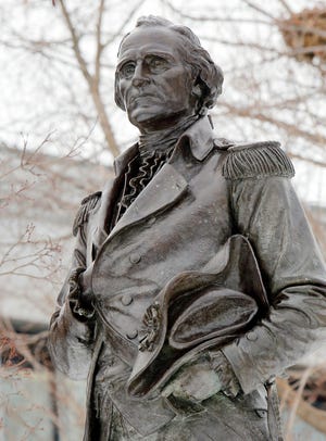 A statue of Gen. John Stark is seen on the Statehouse lawn Thursday Feb. 26, 2015 in Concord, N.H. Stark’s Live Free or Die quote grace New Hampshire’s license plates, but few outside of New England know who the revolutionary war hero is. Two brothers hope to enlighten readers with their new book on the Granite State’s favorite son, who did most of his soldiering in New York. (AP Photo/Jim Cole)