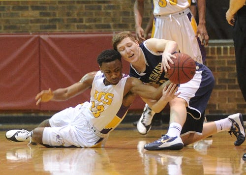 Athens Christian's Rondy Brownlee (13) and Landmark Christian's Zack Allen (25) fight for possession as Athens Christian takes on Landmark Christian at Athens Christian School on Thursday, Feb. 26, 2015 in Athens, Ga.