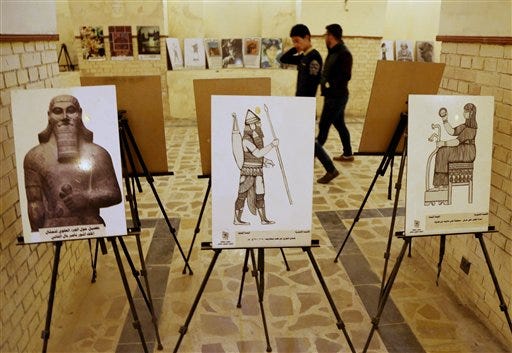 Iraqi artists held an exhibition on antiquities a day after Islamic State militants posted an online video showing them smashing rare ancient artifacts in a museum, in Baghdad, Iraq, Friday, Feb. 27, 2015. (AP Photo/Karim Kadim)