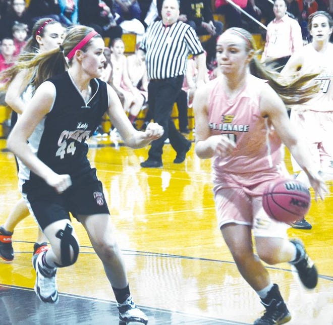 St. Ignace junior guard Abbey Ostman (right) looks to get past Cheboygan junior forward Autumn Hudak during the first half between the two teams in St. Ignace on Friday.