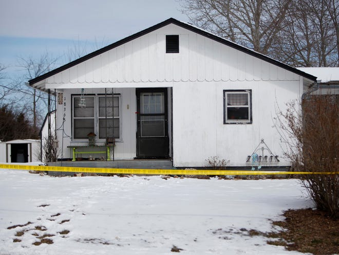 Police tape surrounds one of five crime scenes near Tyrone, Mo., on Friday morning, Feb. 27, 2015. A gunman killed seven people and wounded an eighth person in an overnight house-to-house rampage in the small town in the Missouri Ozarks before apparently committing suicide in a vehicle, authorities said Friday.