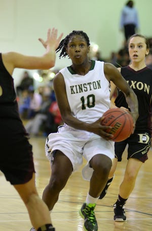 Kinston's Malaysia Lancaster (10) drives to the basket in Friday's win over Dixon at Kinston High School.