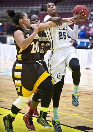 South's Sissy Hall, right, withstands pressure from Thomas Jefferson's Aly Madot, center, and Avery Carter and scores while being fouled during their playoff game on Feb. 27, 2015 at the Events Center in PUeblo, Colo. South won81-56 to advance to the Sweet 16. (Chris McLean, The Pueblo Chieftain)