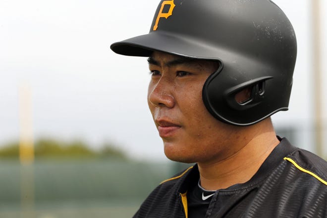 The Pirates' Jung Ho Kang waits his turn in the batting cage during a baseball spring training workout in Bradenton, Fla. on Thursday.