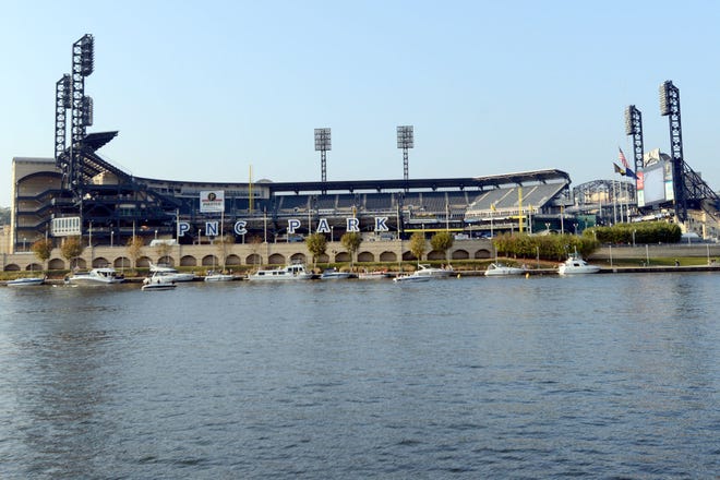 Boats line up on the north shore of the Allegehny River outside PNC Park before the NL Wild Card Playoff baseball game between the Pirates and Giants on Wednesday, Oct. 1, 2014, in Pittsburgh. For the 2015 season, the Pirates have added three new drinking areas to the ballpark's concourse.