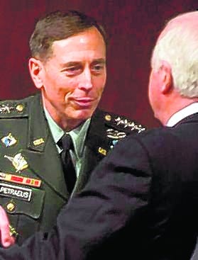 U.S. Army Gen. David Petraeus meets with Sen. Saxby Chambliss, R-Ga., before 
a Senate hearing.
AP PHOTO / STEPHEN CROWLEY