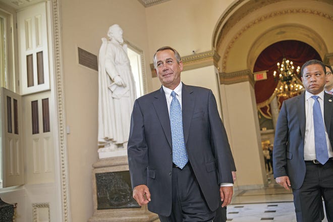 J. Scott Applewhite/Associated Press House Speaker John Boehner of Ohio walks to the House chamber Friday on Capitol Hill in Washington for a procedural vote as Congress moves toward a spending bill for the Homeland Security Department hours before a shutdown was to begin.
