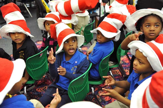 Photos by Bruce.Lipsky@jacksonville.com Jaylah Jackson (center) sings with the other 3-year-old pre-kindergarten students at Monday's celebration of Dr. Seuss' birthday and Read Across America. Happy Birthday, Graduate!, an early childhood initiative, was announced at R.V. Daniels Elementary on Monday.