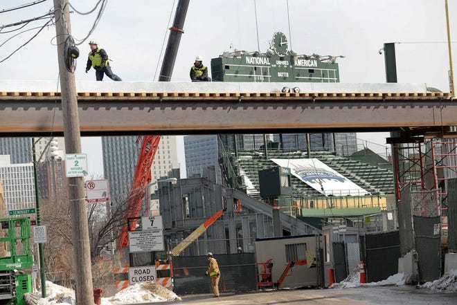 Construction continues while the Chicago Cubs' press forward on renovations to Wrigley Field as opening day approaches Monday, March 2, 2015, in Chicago. The Cubs officials plan to ask the city for permission to work around the clock to speed up Wrigley Field renovations. (AP Photo/Daily Herald, Bob Chwedyk) MANDATORY CREDIT; MAGS OUT
