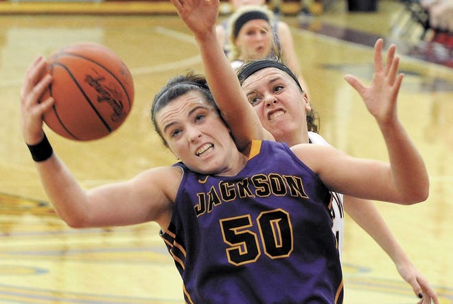 ackson's Abby Duffy pulls down a rebound against Stow's Jessica Stout during a North Canton Division I district semifinal Monday night at Walsh University. Duffy led the Polar Bears with 12 points and eight rebounds. Visit CantonRep.com for more photos from the semifinals.