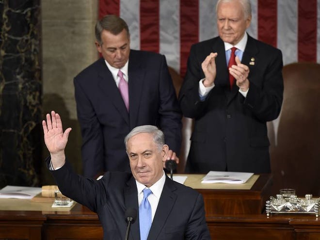 Israeli Prime Minister Benjamin Netanyahu waves as he speaks before a joint meeting of Congress on Capitol Hill in Washington on Tuesday, March 3, 2015.