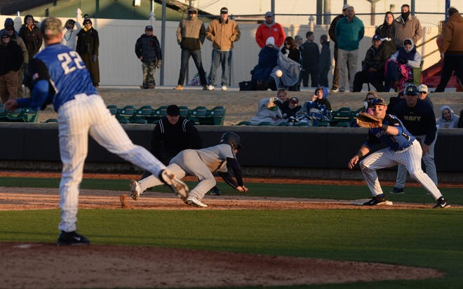 Air Force Academy pitcher Griffin Jax (22) attempts to pick off Navy's Travis Blue (7) at first base during this weekend’s Freedom Classic at Grainger Stadium. Air Force won the series, 2-1.