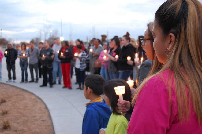 More than 70 people attended a candlelight vigil in honor of former Lubbock Independent School District Police Officer Mitchell Hearn at Coronado High School on Tuesday evening. Hearn, 54, passed away Feb. 23 following a lengthy illness.