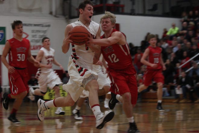 Lincoln's Payton Ebelherr drives to the hoop Tuesday night at Mount Zion. Photos by Bill Welt/The Courier