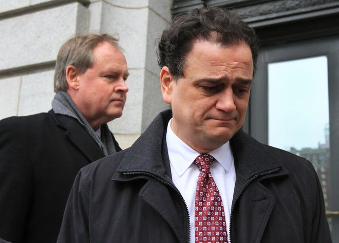 Gordon Fox, right, became emotional on the steps of federal court after pleading guilty Tuesday to bribery and tax fraud. His lawyer, William Murphy, whom Fox succeeded as Speaker of the R.I. House, is behind him.