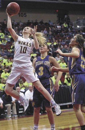 John Gaines/The Hawk Eye Notre Dame's Kori Mesecher (10) drives to the hoop between Central Lyon's Ivy Sieperda (3) and Shaylee Struckman in a Class 1A quarterfinal at the girls state basketball tournament Monday at Wells Fargo Arena in Des Moines. Top-ranked Notre Dame (24-1) plays seventh-ranked Newell-Fonda (21-4) in a semifinal game at 8:30 p.m. today.