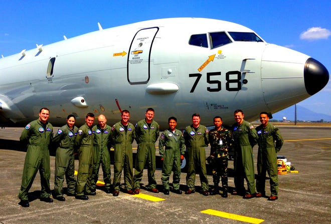 VP-45 "Pelicans" Combat Aircrew 4 stand with members of the Philippine Air Force and Navy.