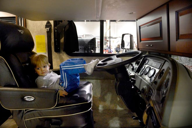 In this Journal Star file photo from March 3, 2013, Drew White, 3, takes the driver's seat of a recreational vehicle in stride at the Central Illinois Recreational Show at Peoria Civic Center Saturday with his parents Derick and Amanda White, of Peoria. Dozens of boats, recreational vehicles, all terrain vehicles, hot tubs and vacation vendors were on display.