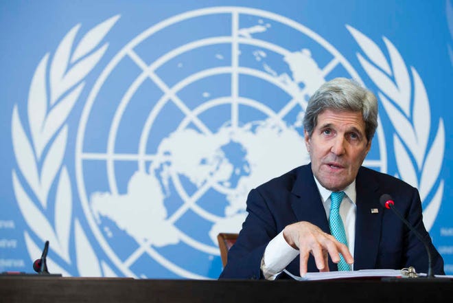 Secretary of State John Kerry gestures during a news conference after he delivered remarks to the United Nations Human Rights Council on Monday, March 2, 2015, in Geneva. Kerry discussed ongoing nuclear negotiations with Iran, and tensions with Russia over Ukraine. (AP Photo/Evan Vucci)