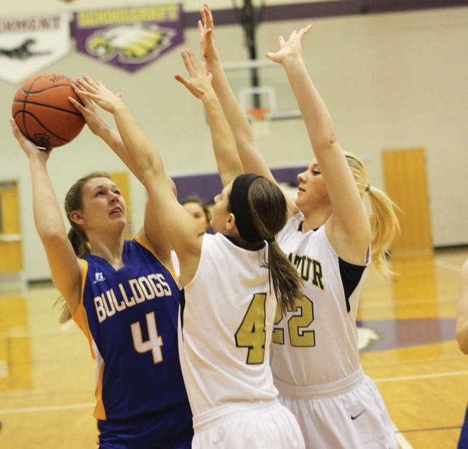 Bailee May of Centreville looks to get a shot up around a pair of Decatur defenders on Wednesday night.