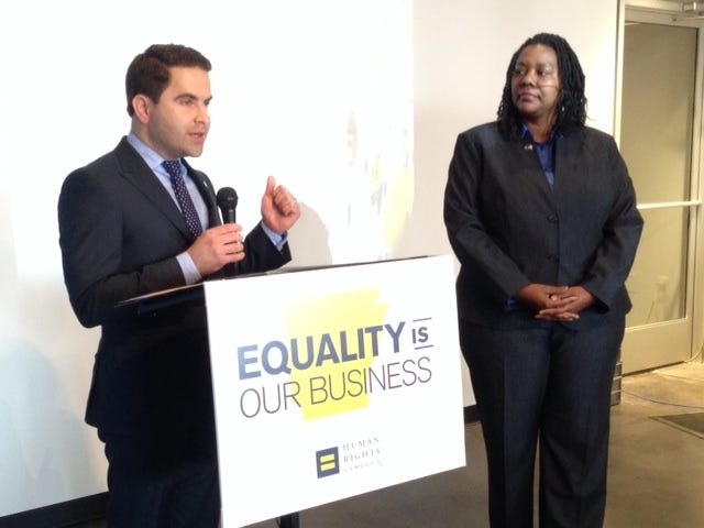 JOHN LYON • ARKANSAS NEWS BUREAU State Rep. Warwick Sabin, D-Little Rock, and Kendra Johnson, Arkansas state director for the Human Rights Campaign, speak at a news conference in North Little Rock on Tuesday, March 3, 2015. The group said more than 100 Arkansas businesses have signed a pledge to support workplace diversity and inclusion.