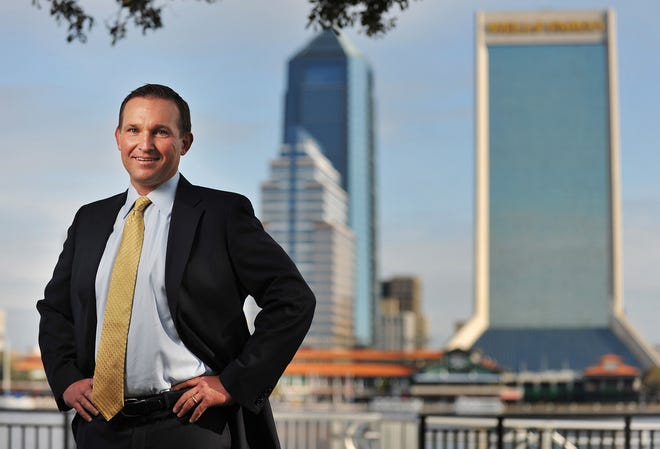 Mayoral candidate Lenny Curry poses for a portrait on the new Southbank Riverwalk on Thursday in Jacksonville.