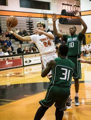 Photo by Warren Westura/New Jersey Herald - Hackettstown Tiger Jeremy DelValle (24) puts the ball up at the North 2 Group 2 Quarterfinal at Hackettstown High School Wednesday.