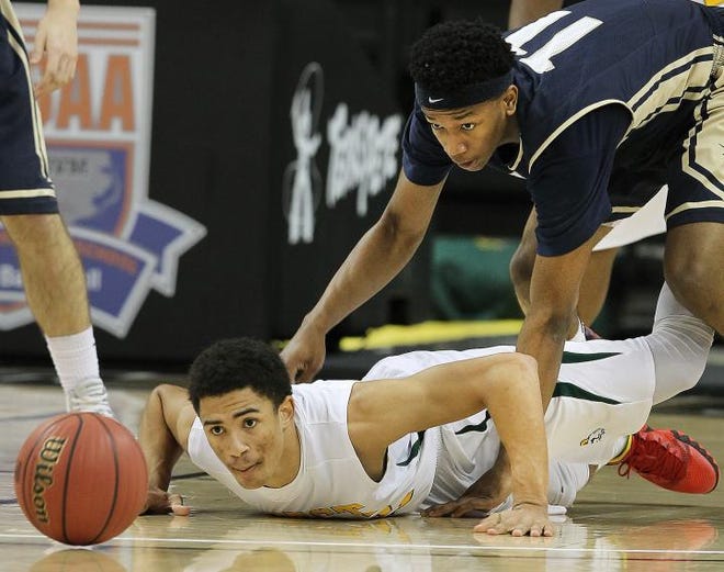 Crest's Jerick Haynes and Cuthbertson's Ryan Mobley scramble after a loose ball during the Chargers' 63-54 win Thursday evening in Winston-Salem. (John Clark / Gatehouse Media)