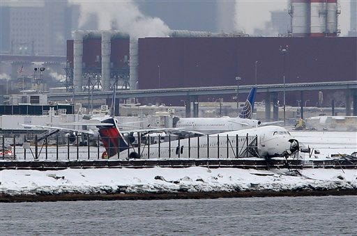 A Delta plane skidded off the runway at LaGuardia Airport during a snowstorm, Thursday, March, 5 2015, in New York. Delta Flight 1086, carrying 125 passengers and five crew members, veered off the runway at around 11:10 a.m., authorities said. Six people suffered non-life-threatening injuries, said Joe Pentangelo, a spokesman for the Port Authority of New York and New Jersey, which runs the airport.