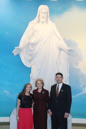 Brooke McSheehy is pictured with her Mission President and Mrs. Kirk L. Jenkins at Arizona Mesa Mission