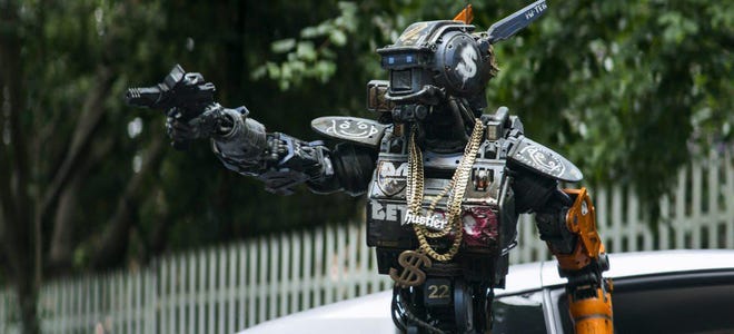 In "Chappie," a robot comes alive, amazed and confused and a little scared of the new world around him.