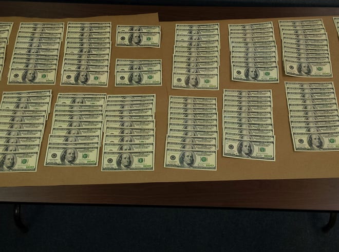 Authorities seized more than $15,000 in counterfeit money.