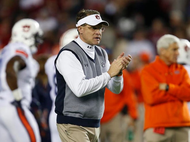 Auburn coach Gus Malzahn and Mississippi coach Hugh Freeze were among a group of coaches who asked rules oversight panel committee chairman Troy Calhoun to table the proposal on changing the illegal man downfield rule from 3 yards to 1.