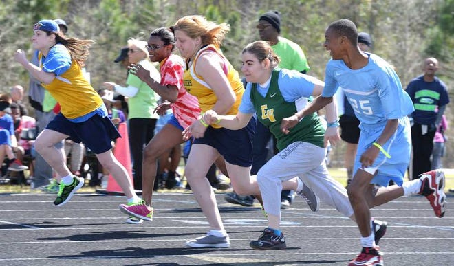 Photos by Bruce.Lipsky@jacksonville.com Runners take off at the start of the first heat of the 100-meter race in the Special Olympics Florida Duval County Summer Games on Saturday at Atlantic Coast High School. About 350 athletes participated with the help of 150 volunteers.