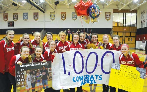 Submitted photo/High Point senior April Peterson (fourth from right, with teddy bear) scored her 1,000th career point on Friday night at Northern Highlands High School.