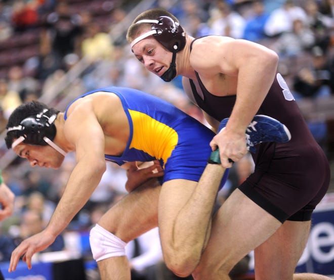 Stroudsburg's Jake Jakobsen lays hands on Kellan Stout of Mount Lebanon during the 182-pound PIAA Class AAA championship bout on Saturday in Hershey. Jakobsen fell to Stout and took home the silver. (Keith R. Stevenson/Pocono Record)