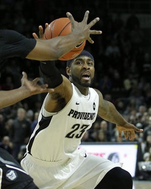 Ladontae Henton reaches for the ball during Saturday's win over Butler at the Dunkin Donuts Center.