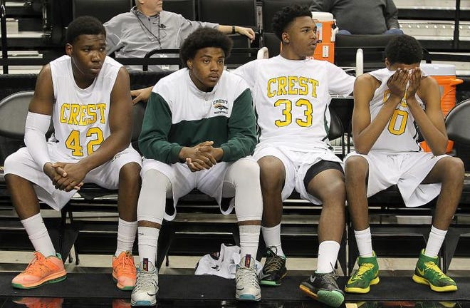 Charger players show their disappointment at the end of Saturday's one-point loss to Ashbrook in the 3A West Regional finals at Wake Forest. (John Clark / Gatehouse Media)